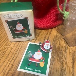 Hallmark Dancing  Santa Ornament with Red and Green accents.